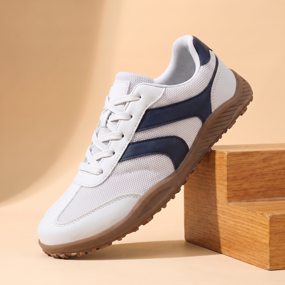 Wide Toe Trail Sneakers in white with navy blue side stripes and gum sole