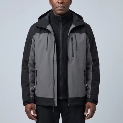 Men's grey waterproof hooded hiking jacket with black side panels, worn open over a black fleece