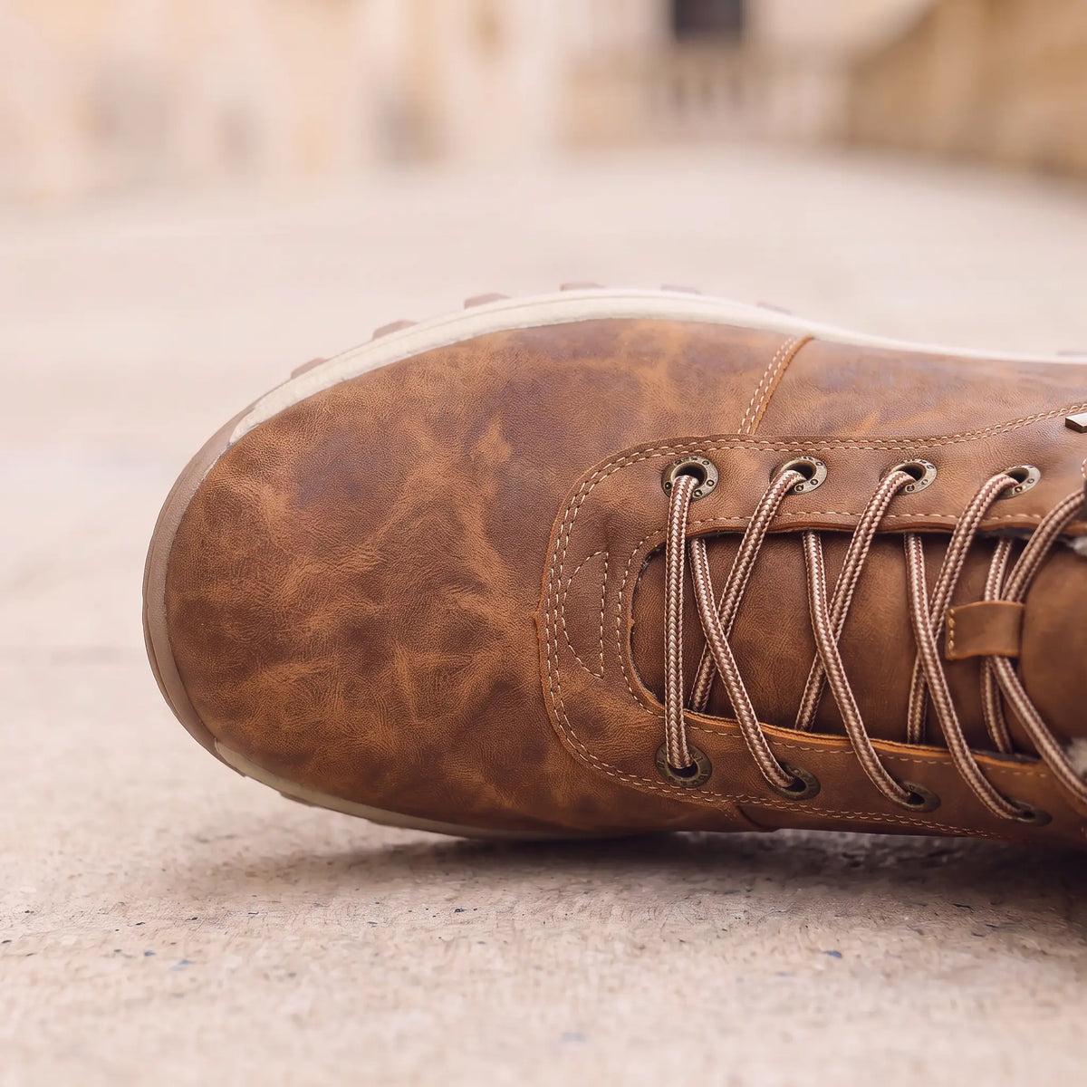 Winter Hiking Boots in Brown, front half close-up showing the laces and lug sole