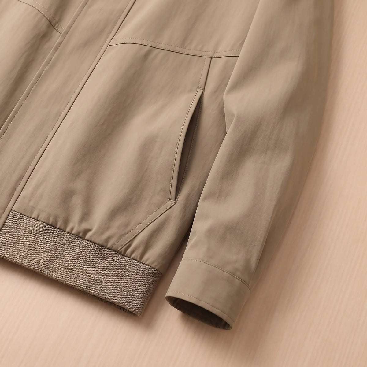 Close-up of the ribbed hem band and welt pocket