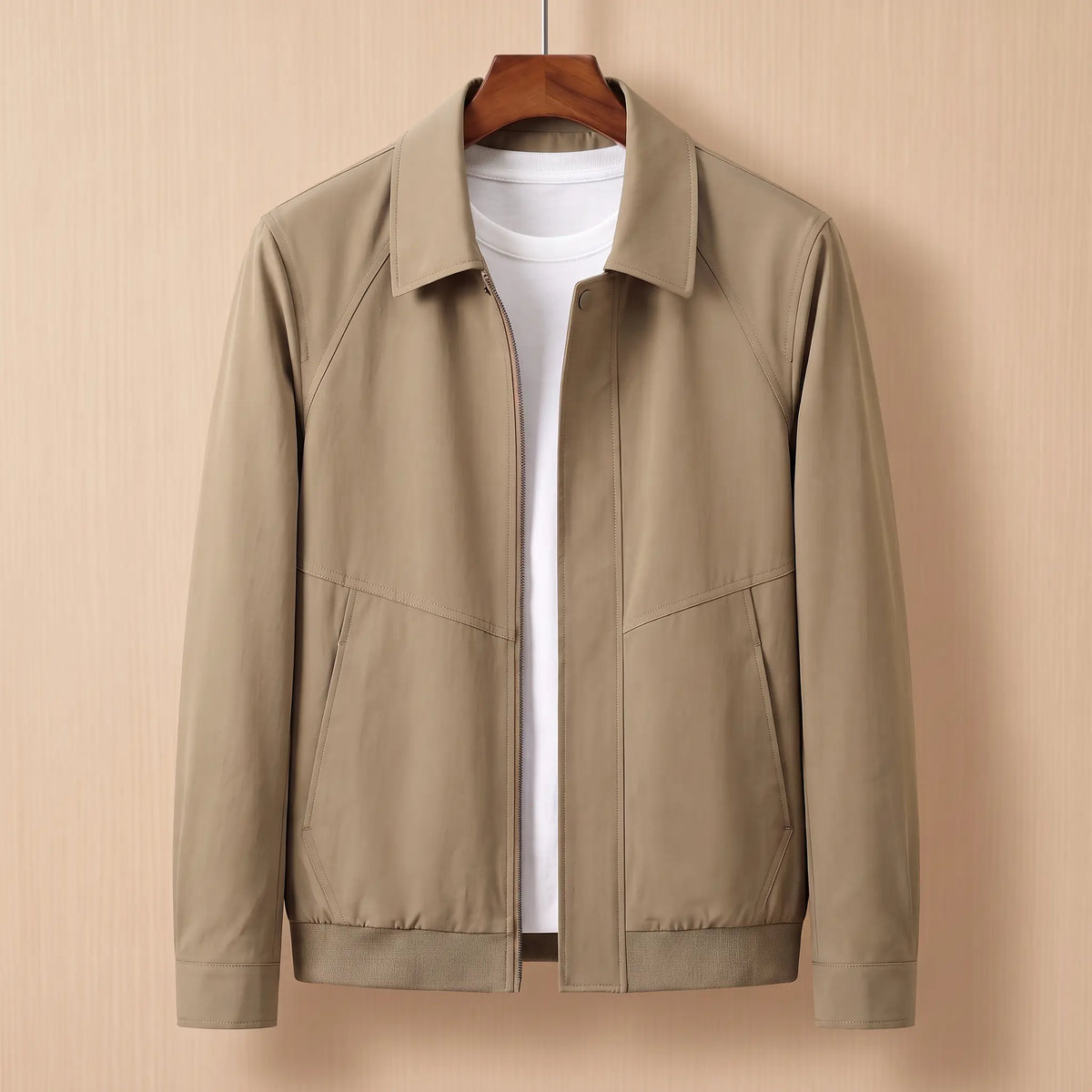 Zip front harrington jacket in khaki on a wooden hanger