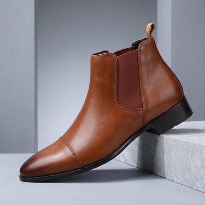 SMOOTH GENTLEMAN BOOTS light brown cognac Chelsea boot on a grey stone plinth in a cool grey studio
