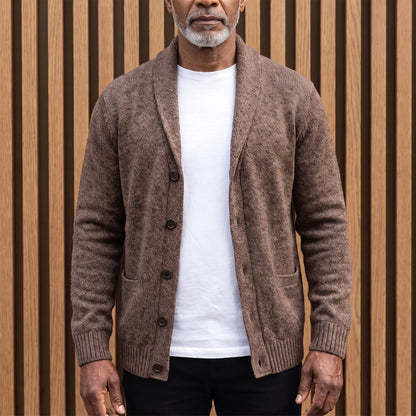 Men's brown flecked knit shawl collar cardigan worn open over a white tee