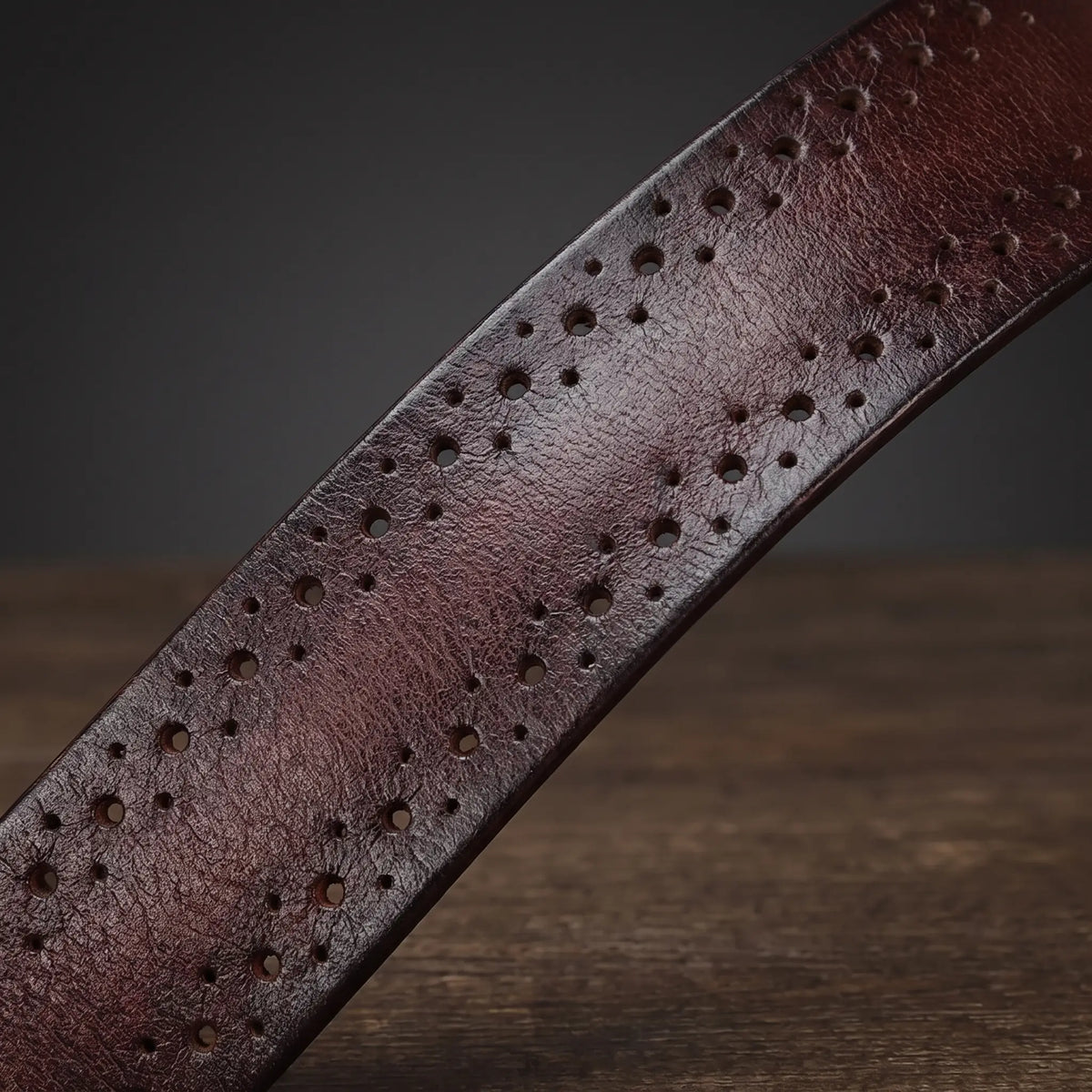 Antique brass belt perforated strap detail