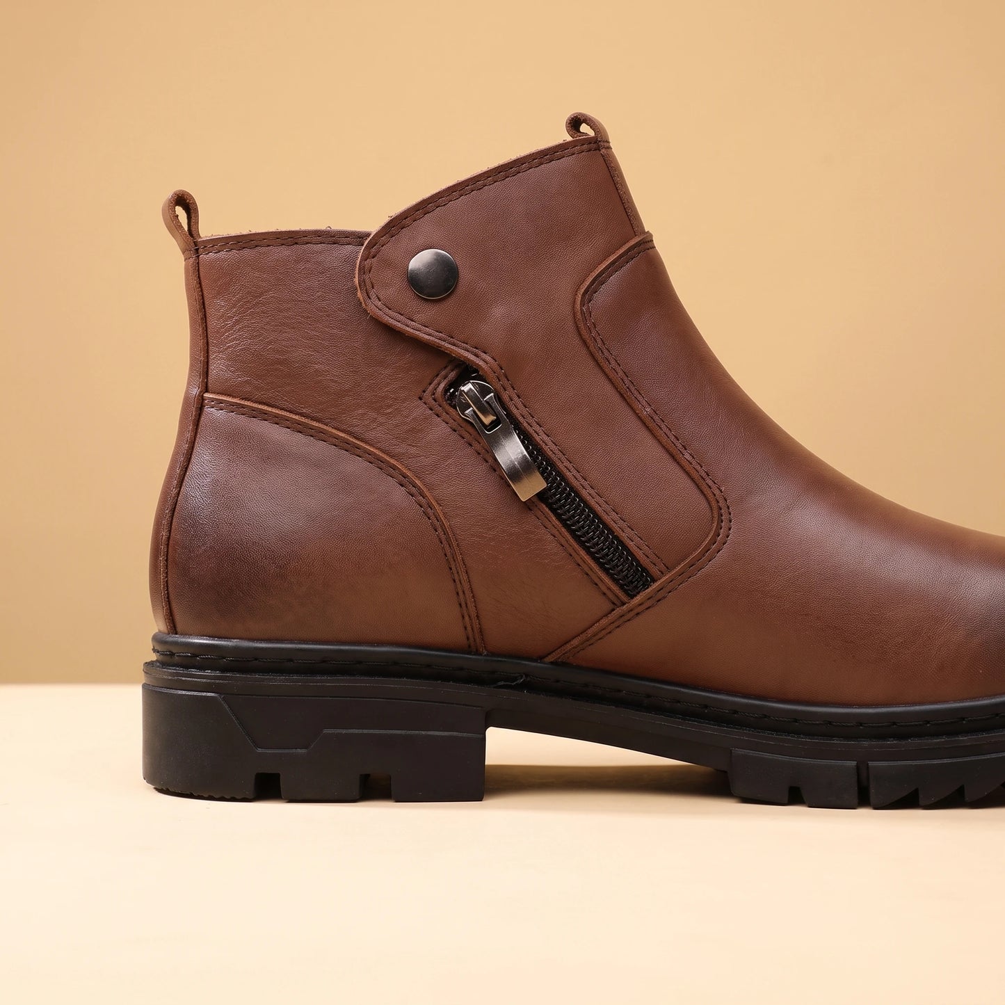 SHARP ZIP ANKLE BOOTS close-up of the thick rugged lug sole