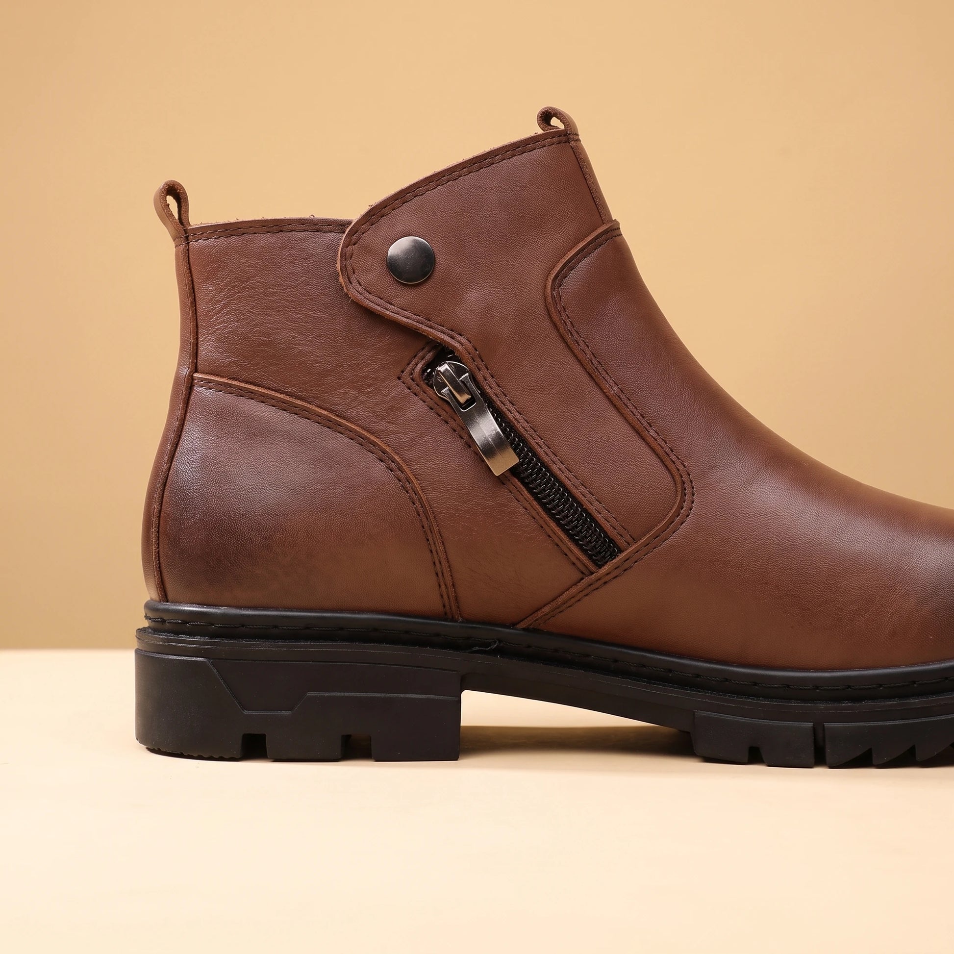 SHARP ZIP ANKLE BOOTS close-up of the thick rugged lug sole