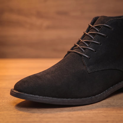 Close-up of black desert boot upper and laces