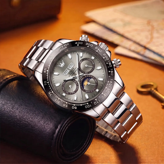 Black Bezel Watch with grey dial, moon phase and day dial, on a polished steel link band
