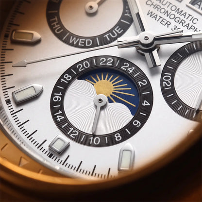 Close up of the moon phase dial with its gold sun and moon face on the Black Bezel Watch
