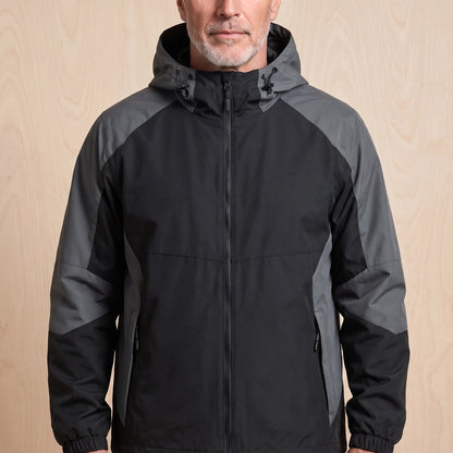 Black hooded panel windbreaker with grey colour block sleeves worn by a man, front view