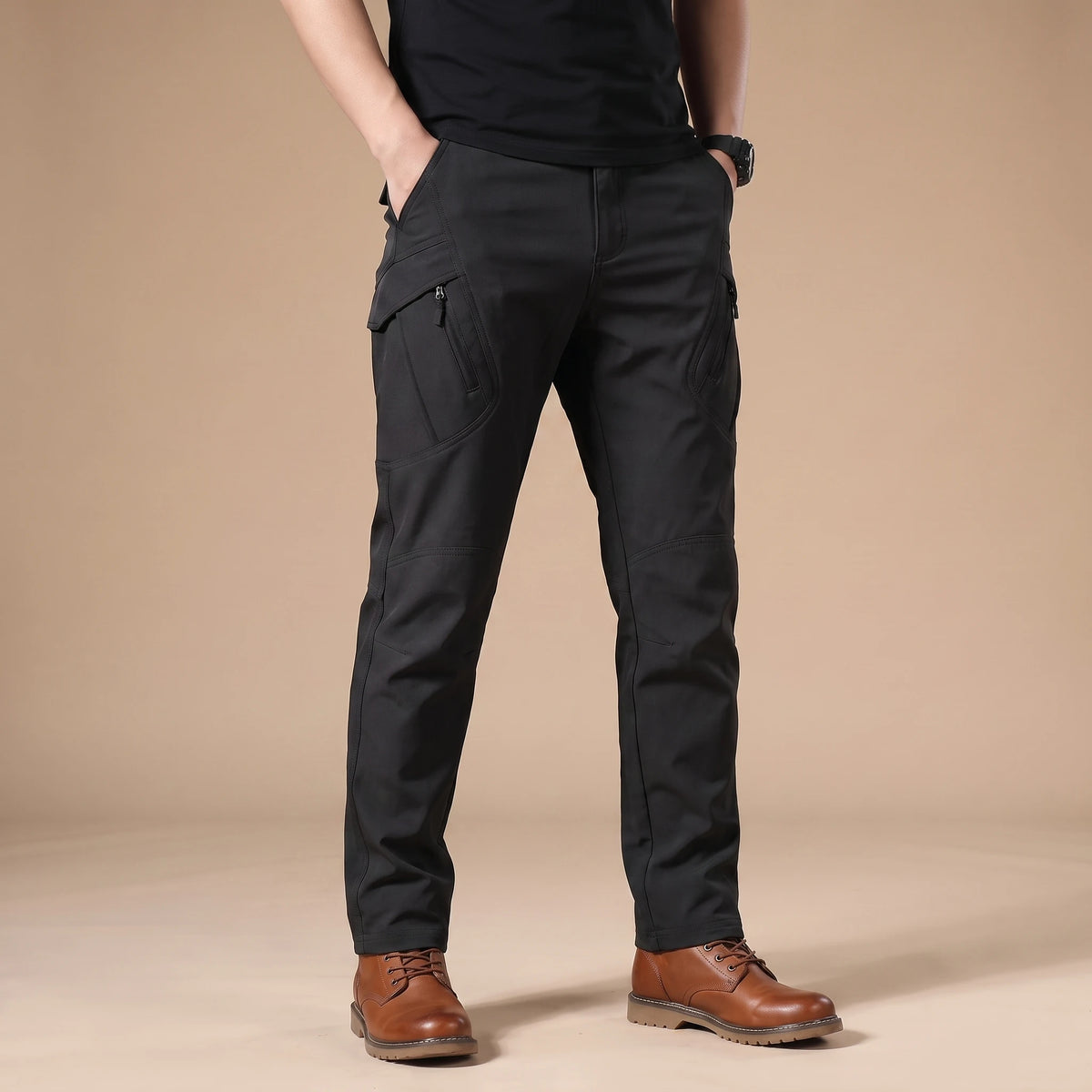Stretch cargo trousers in black, worn front view in a warm studio
