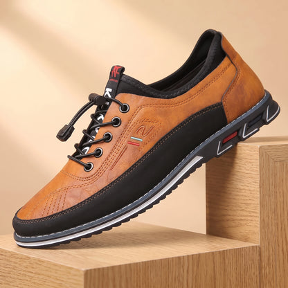 SMART CASUAL SNEAKERS orange-tan casual leather sneaker on a light oak platform, warm daylight