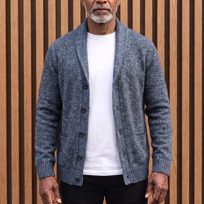 Men's slate blue flecked knit shawl collar cardigan worn open over a white tee