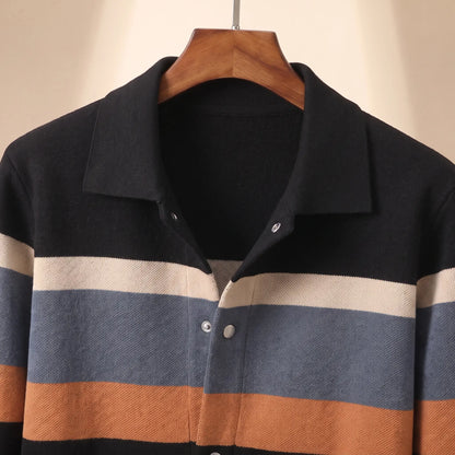 Close up of the flat turn down collar, silver snap buttons and chest bands on the black orange Chest Band Knit