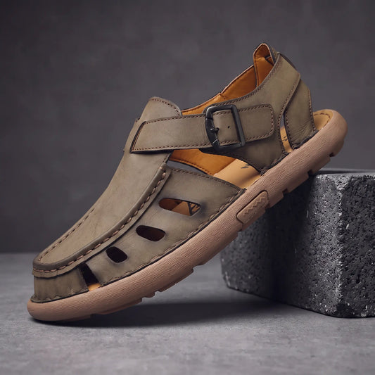 Khaki Roman leather sandal on charcoal block