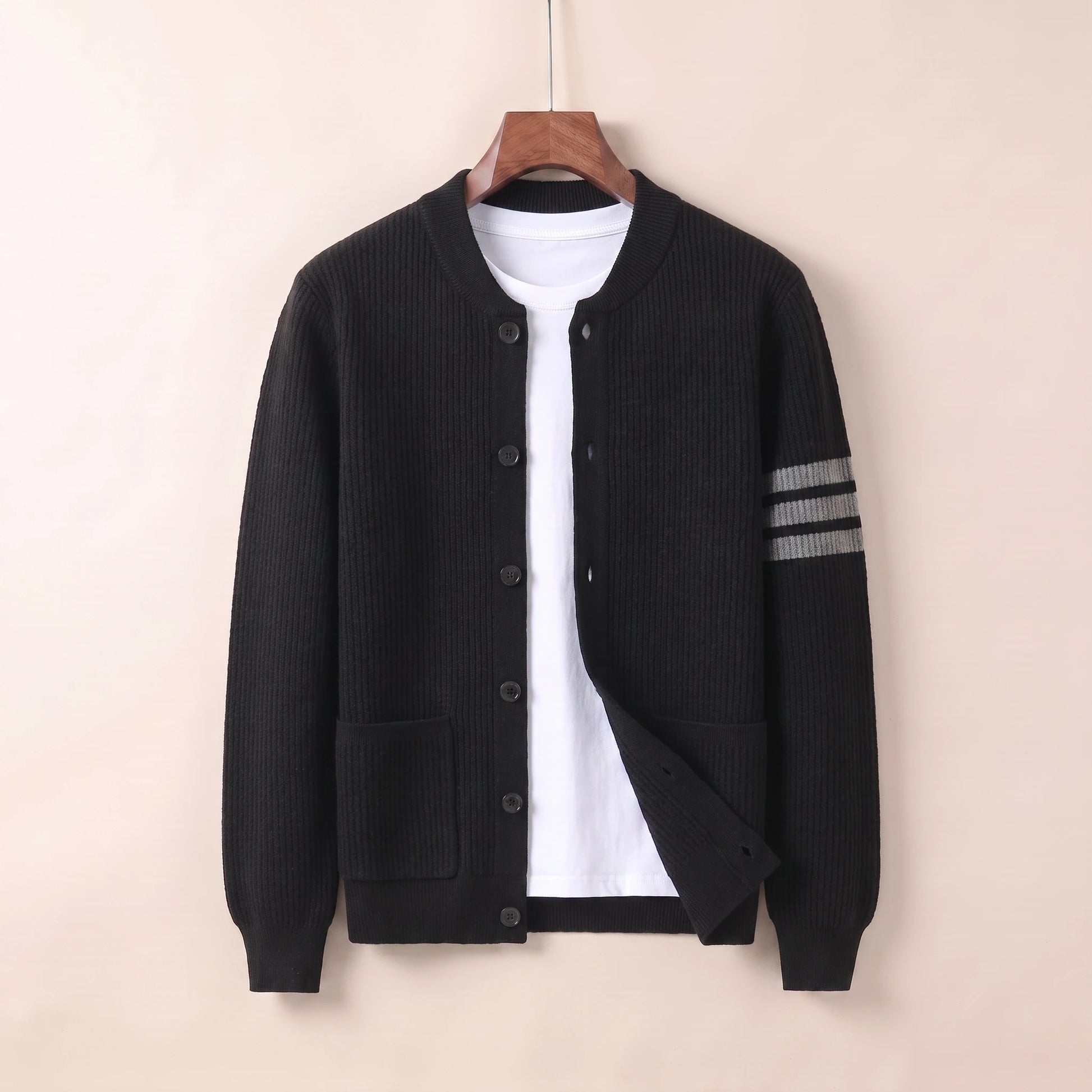 Black knit button cardigan coat on hanger