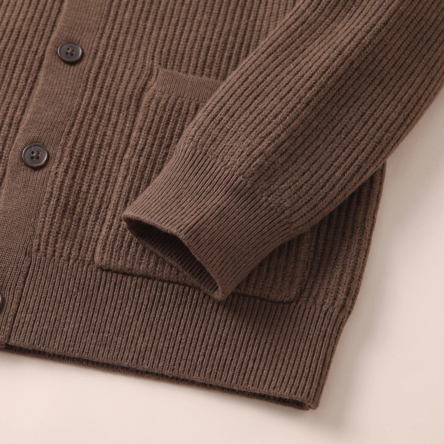 Knit cardigan cuff and hem ribbing detail