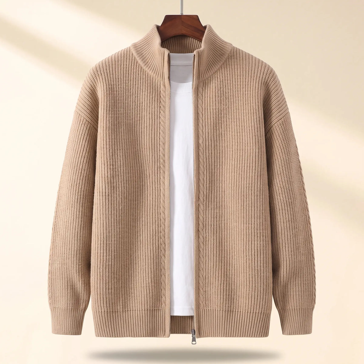 Cold Weather Cardigan in khaki, a thick ribbed knit full zip cardigan jacket with a stand collar on a wooden hanger