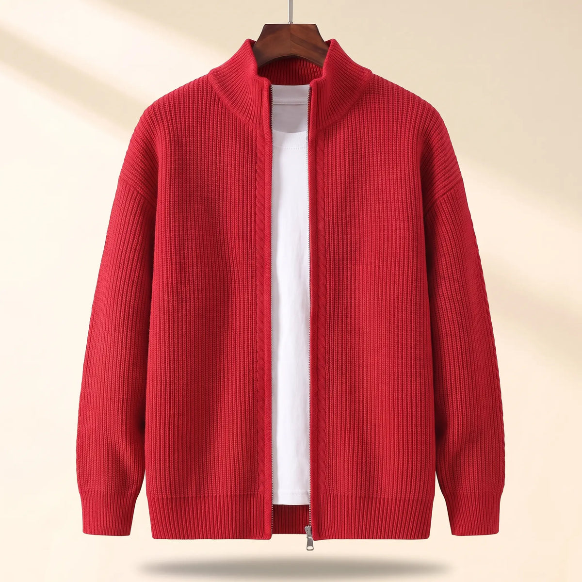 Cold Weather Cardigan in red, a thick ribbed knit full zip cardigan jacket with a stand collar on a wooden hanger