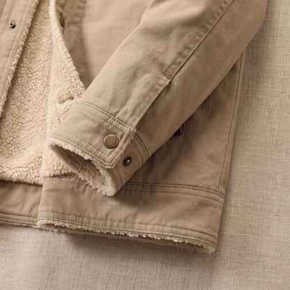 Close up of the buttoned tab cuff and straight hem