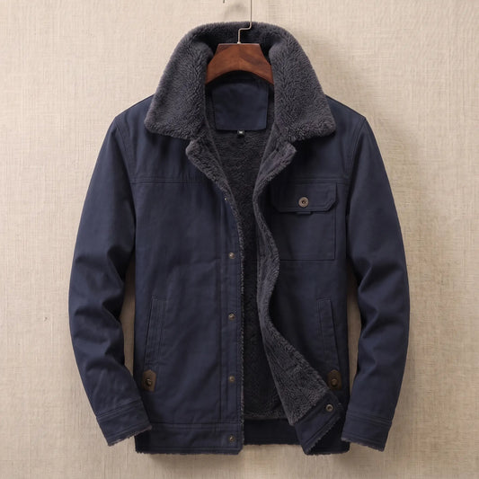 Navy cotton canvas sherpa lined jacket on a wooden hanger