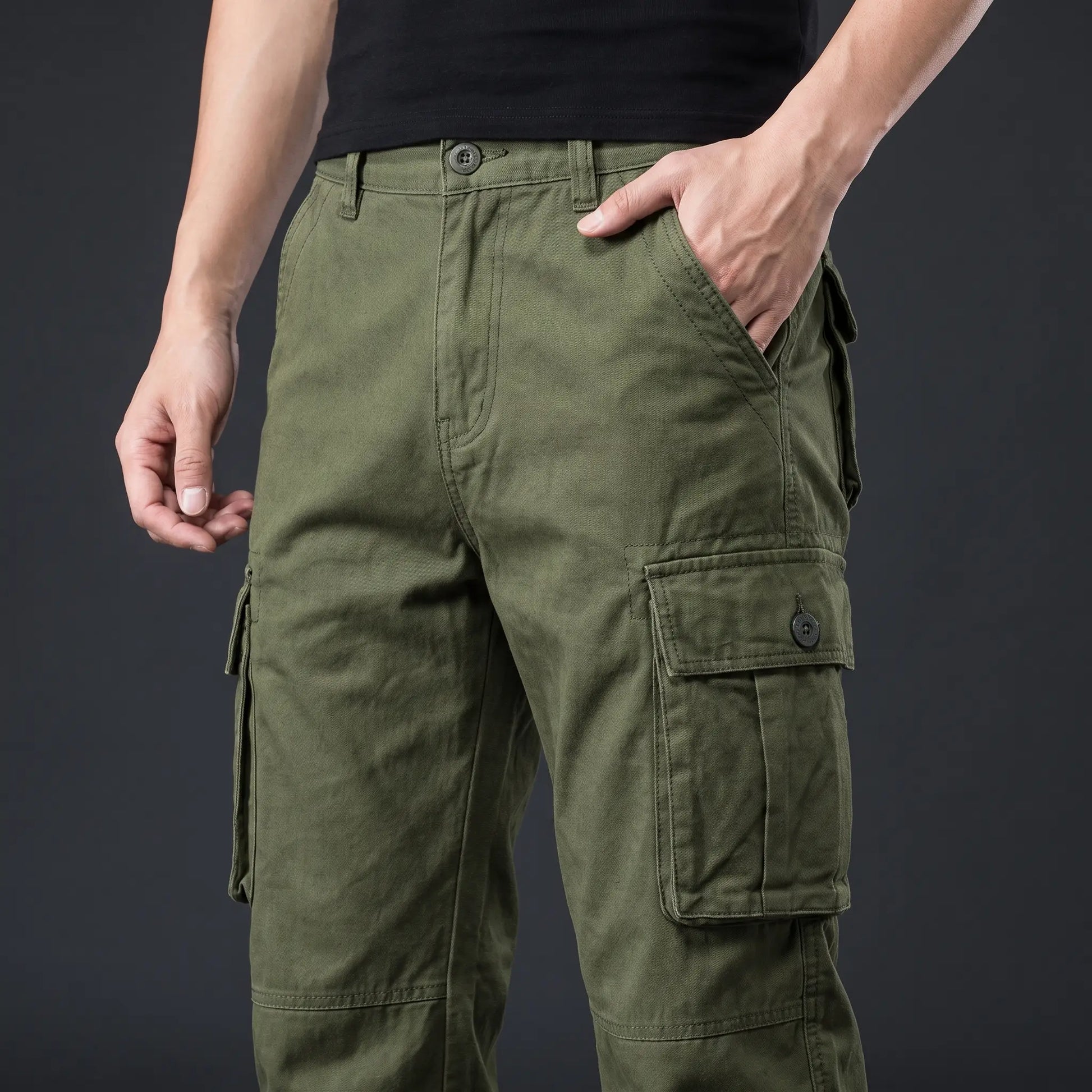 Hand resting in the front pocket of the cargo trousers