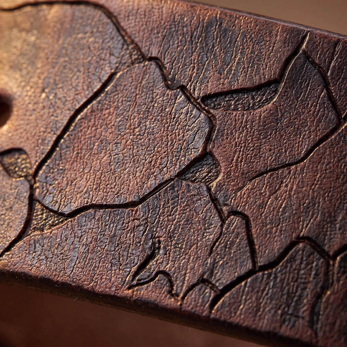 Macro close up of the pressed crack pattern in the leather on the Cracked Texture Belt