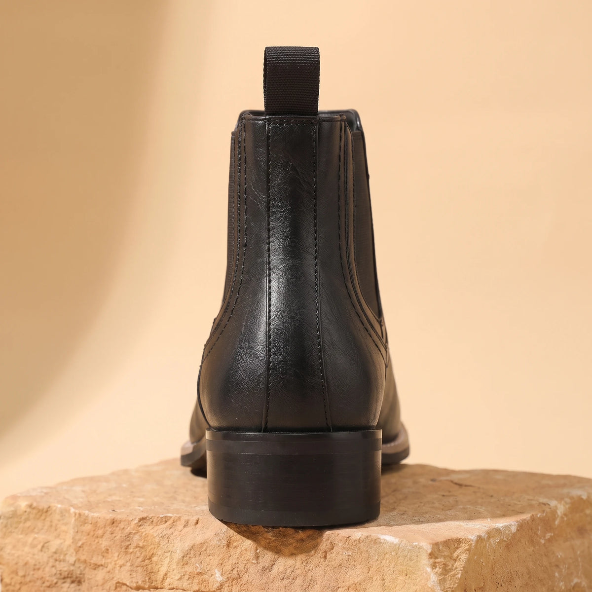 Close-up of black Chelsea boot heel and back