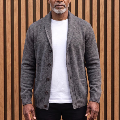 Men's charcoal grey flecked knit shawl collar cardigan worn open over a white tee