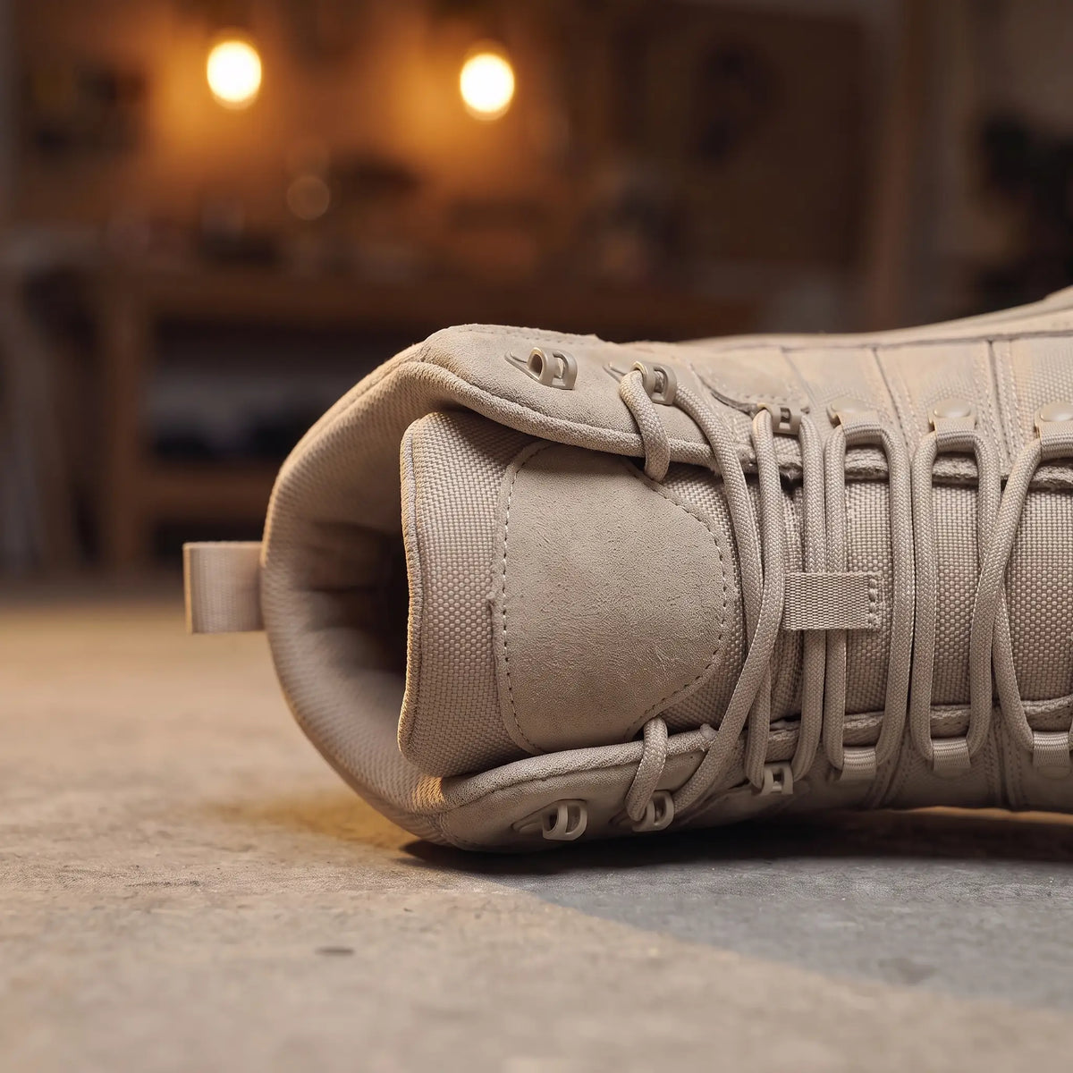 Close up of the padded ankle collar, upper speed hooks and rear pull tab on the sand Deep Lug Boots