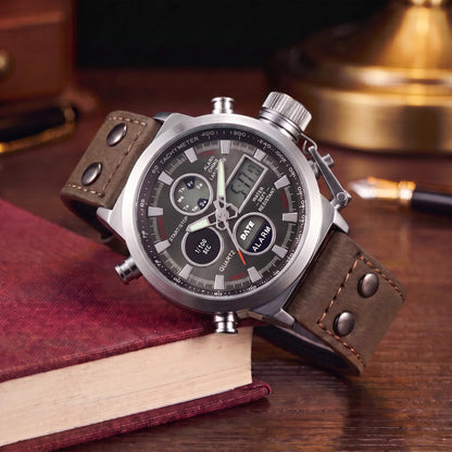 Dual Display Watch with brown leather strap, silver case and black dial, analog and digital display, draped over a book stack