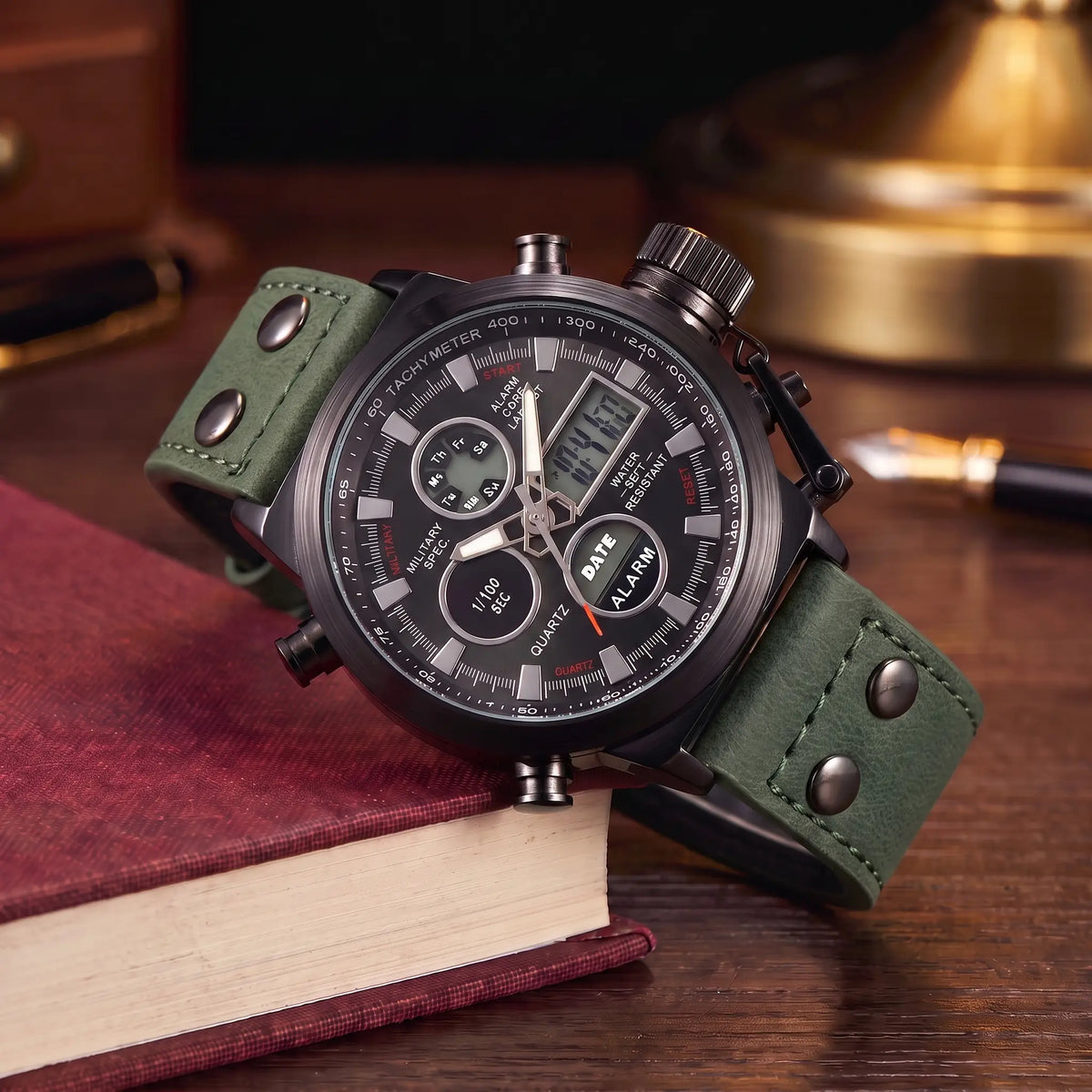 Dual Display Watch with green leather strap, black case and black dial, analog and digital display, draped over a book stack