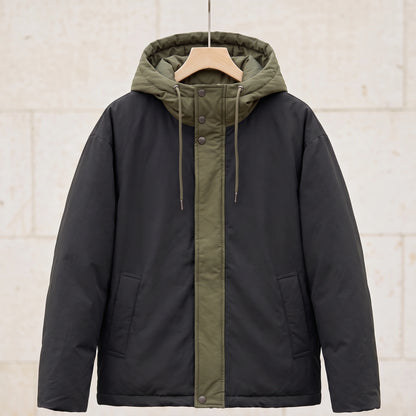 Black padded hooded parka with olive hood and front panel on a wooden hanger, front view