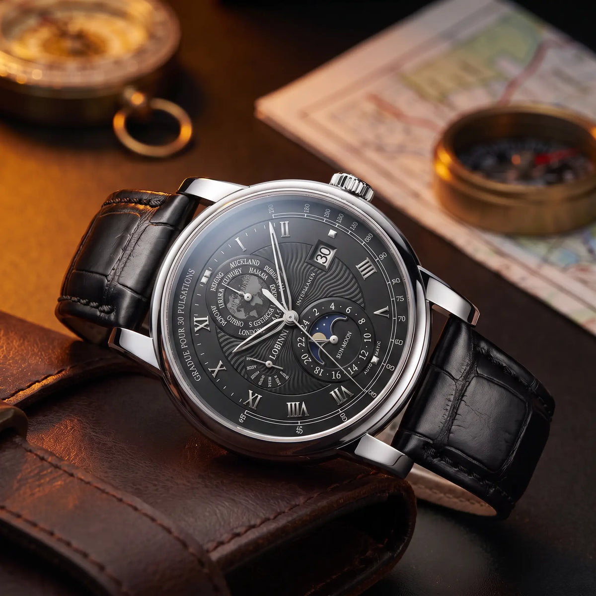Silver case black dial moon phase watch on a black leather strap