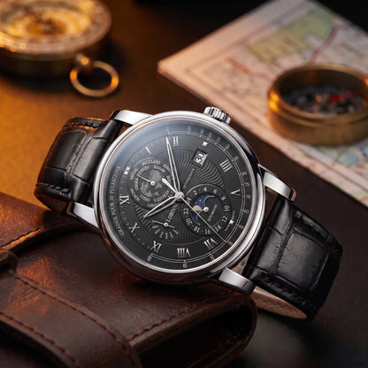 Silver case black dial moon phase watch on a black leather strap