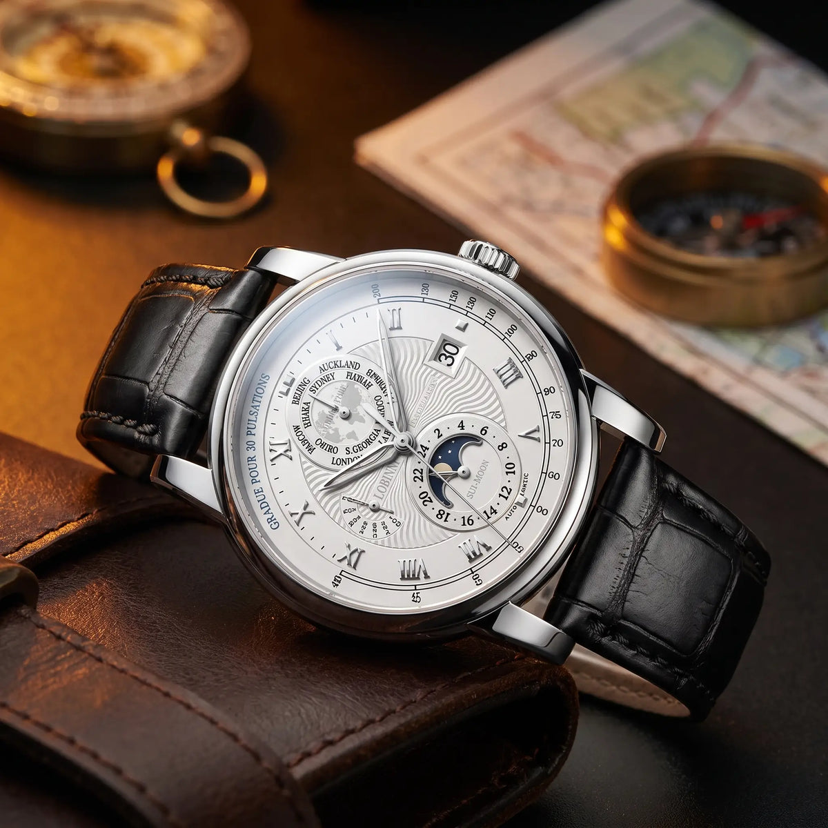 Silver case white dial moon phase watch on a black leather strap