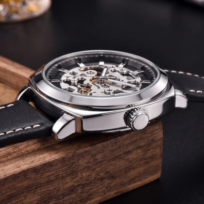 Side profile of the Exposed Gear Watch showing the crown, case and strap stitching