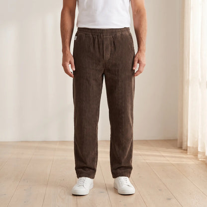 Men's brown wide wale corduroy loose straight trousers with elastic waist, worn