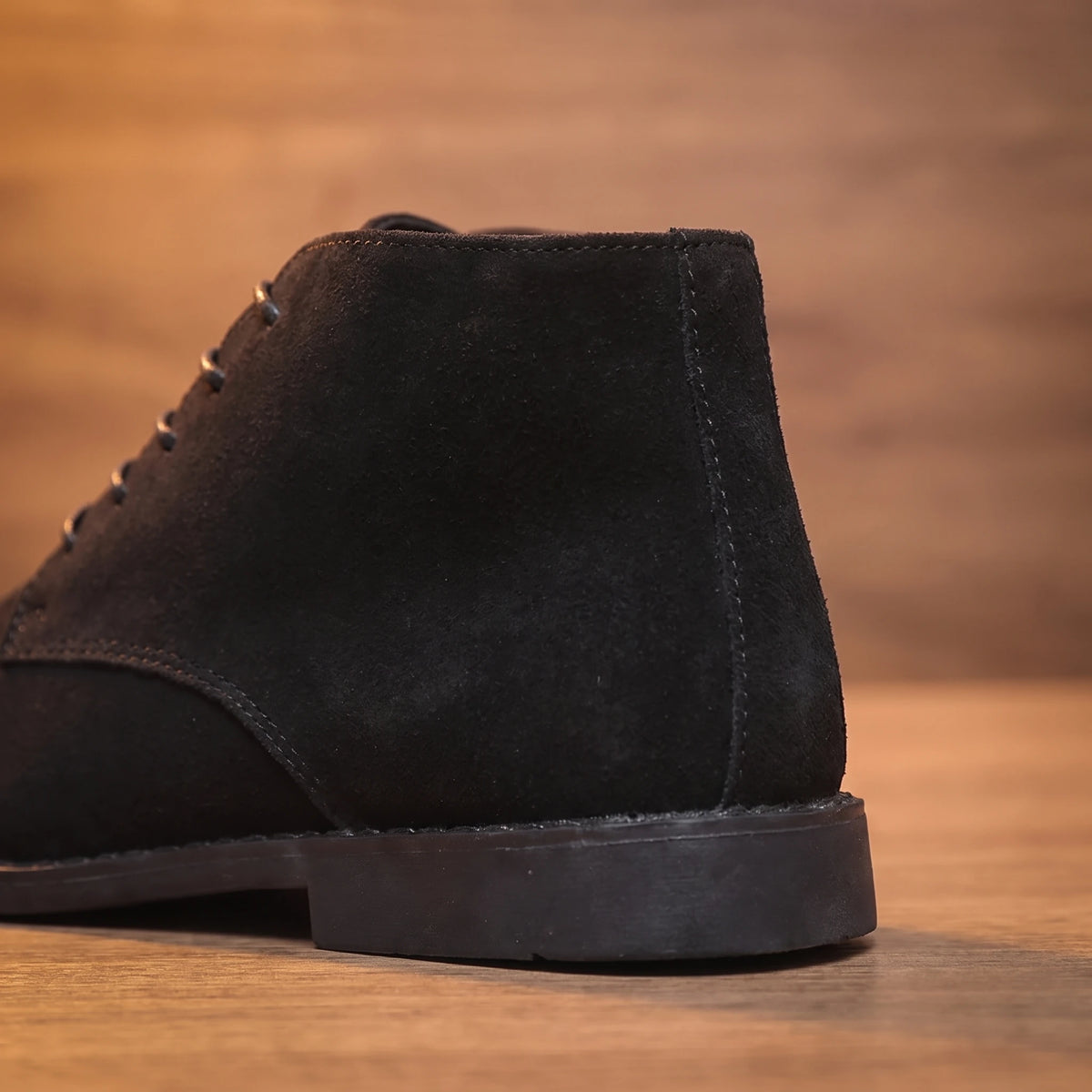 Close-up of black desert boot heel and back