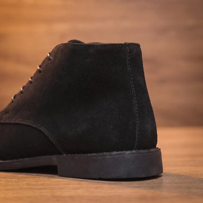 Close-up of black desert boot heel and back