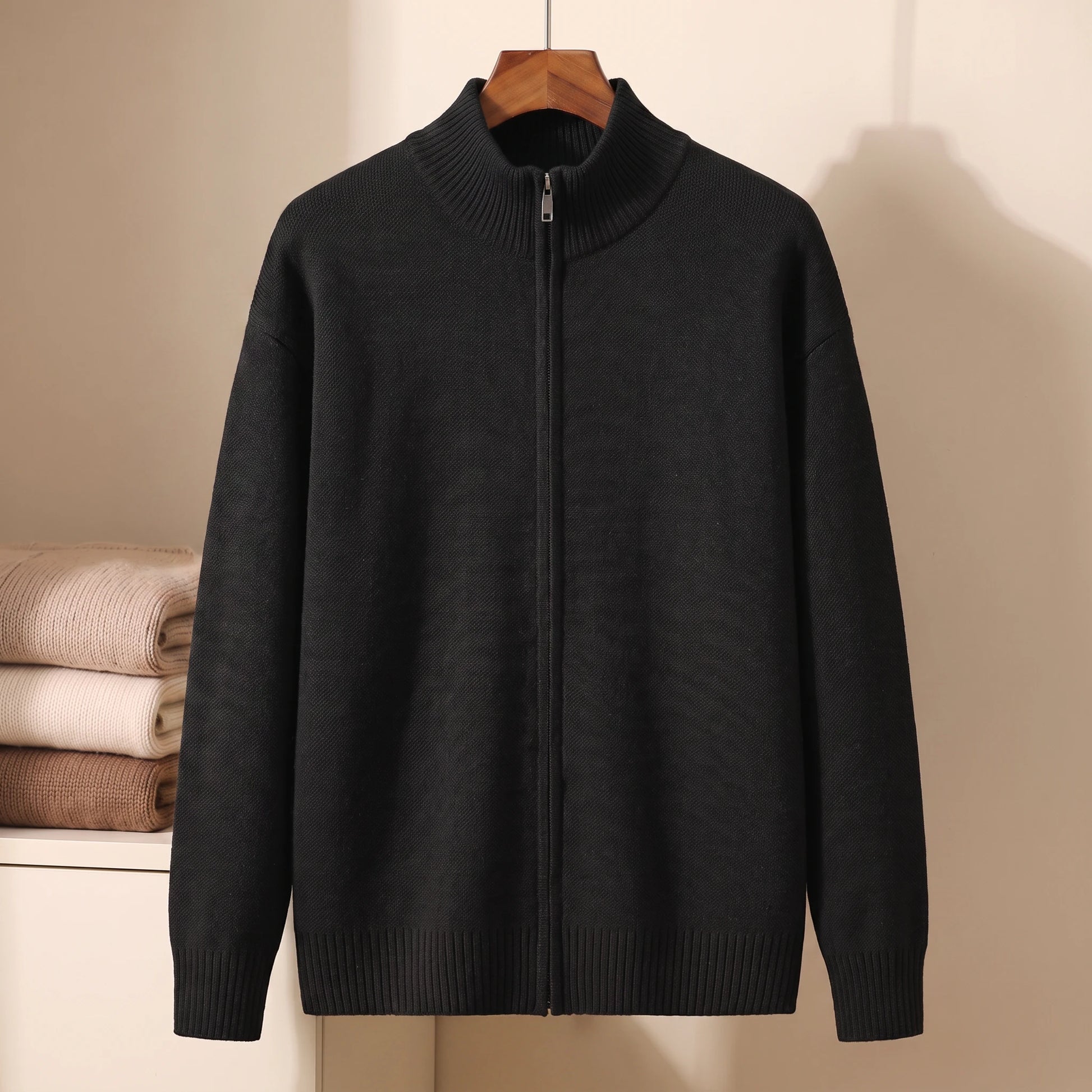 Black full-zip stand-collar knit sweater on hanger