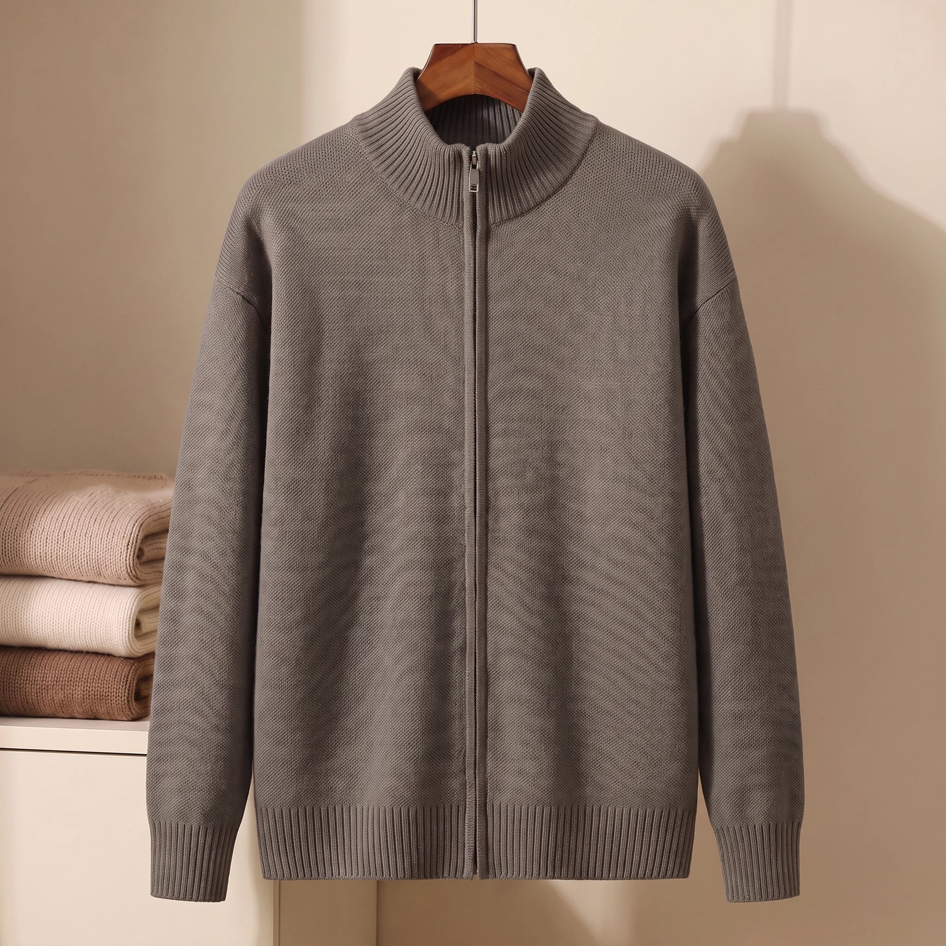 Dark grey full-zip stand-collar knit sweater on hanger