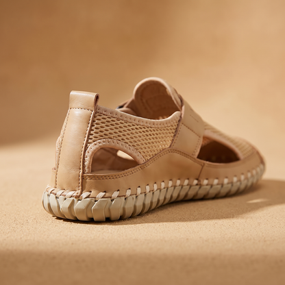 Woven Mesh Sandals detail - close-up of the heel and whipstitched cream rubber sole edge