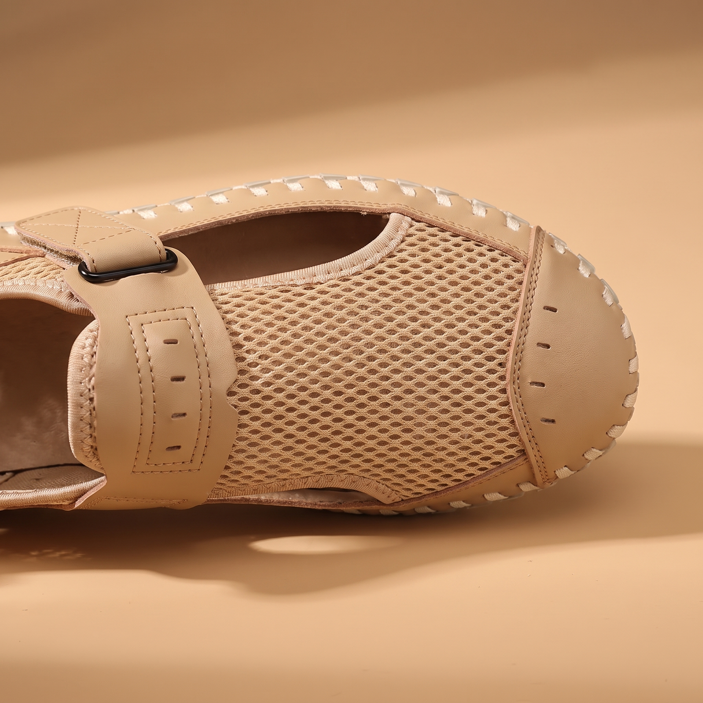 Woven Mesh Sandals detail - close-up of the velcro cross-strap and breathable mesh weave at the toe