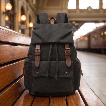Explorer Canvas Backpack in black - vintage waxed-canvas laptop backpack with leather buckle straps