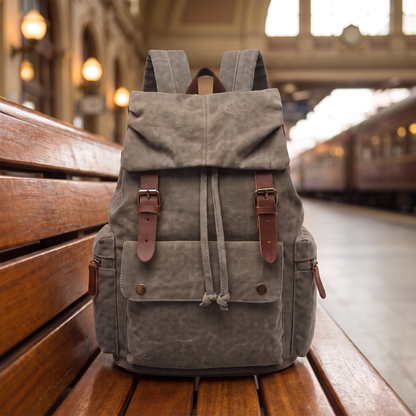Explorer Canvas Backpack in gray - vintage waxed-canvas laptop backpack with leather buckle straps