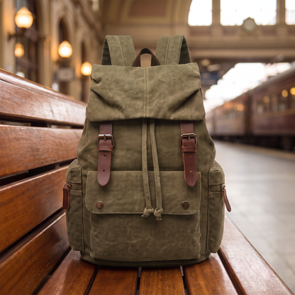 Explorer Canvas Backpack in army green - vintage waxed-canvas laptop backpack with leather buckle straps