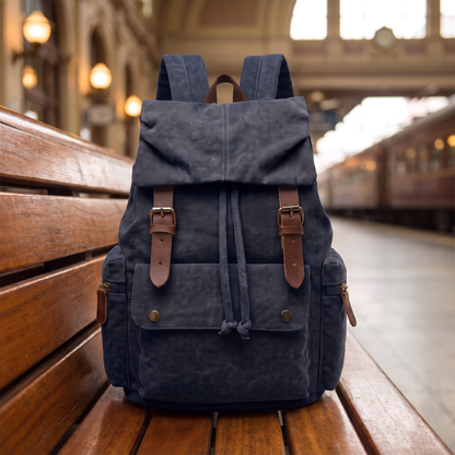 Explorer Canvas Backpack in dark navy - vintage waxed-canvas laptop backpack with leather buckle straps