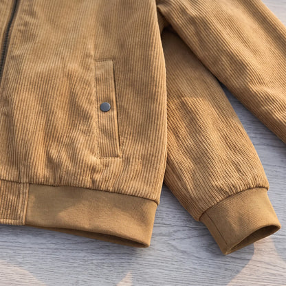 Close up of the corduroy Harrington jacket ribbed hem, snap pocket and knit cuff
