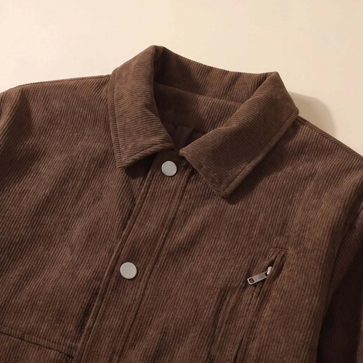 Close up of the winter corduroy jacket collar and snap front placket